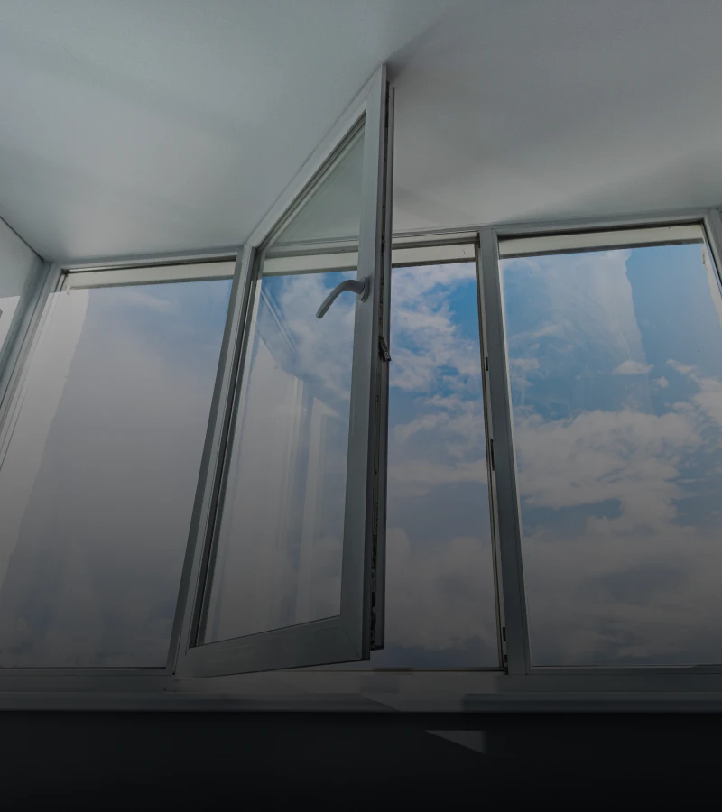 Bright clouds seen through open window